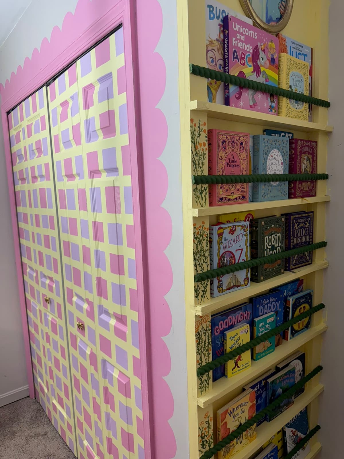 A hand-painted kids' reading nook with rainbow bookshelves