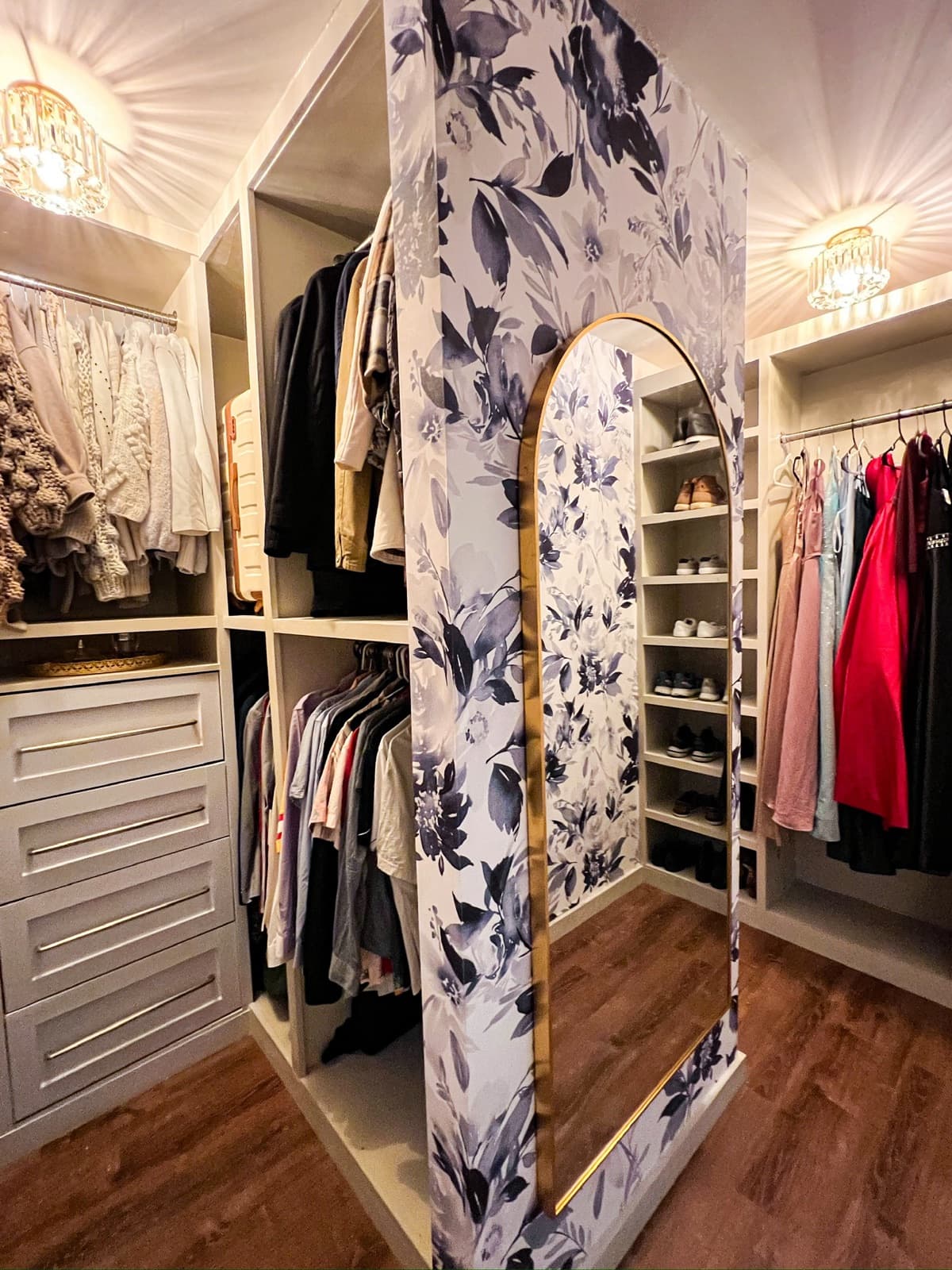 Closet makeover with floral wallpaper and arch mirror